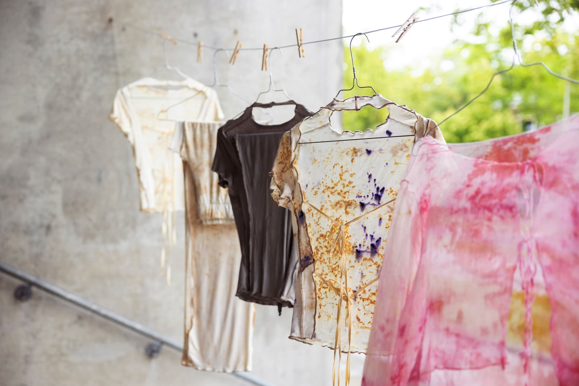 Colourful clothing items are displayed on a washing line. Photo: Florine van Rees