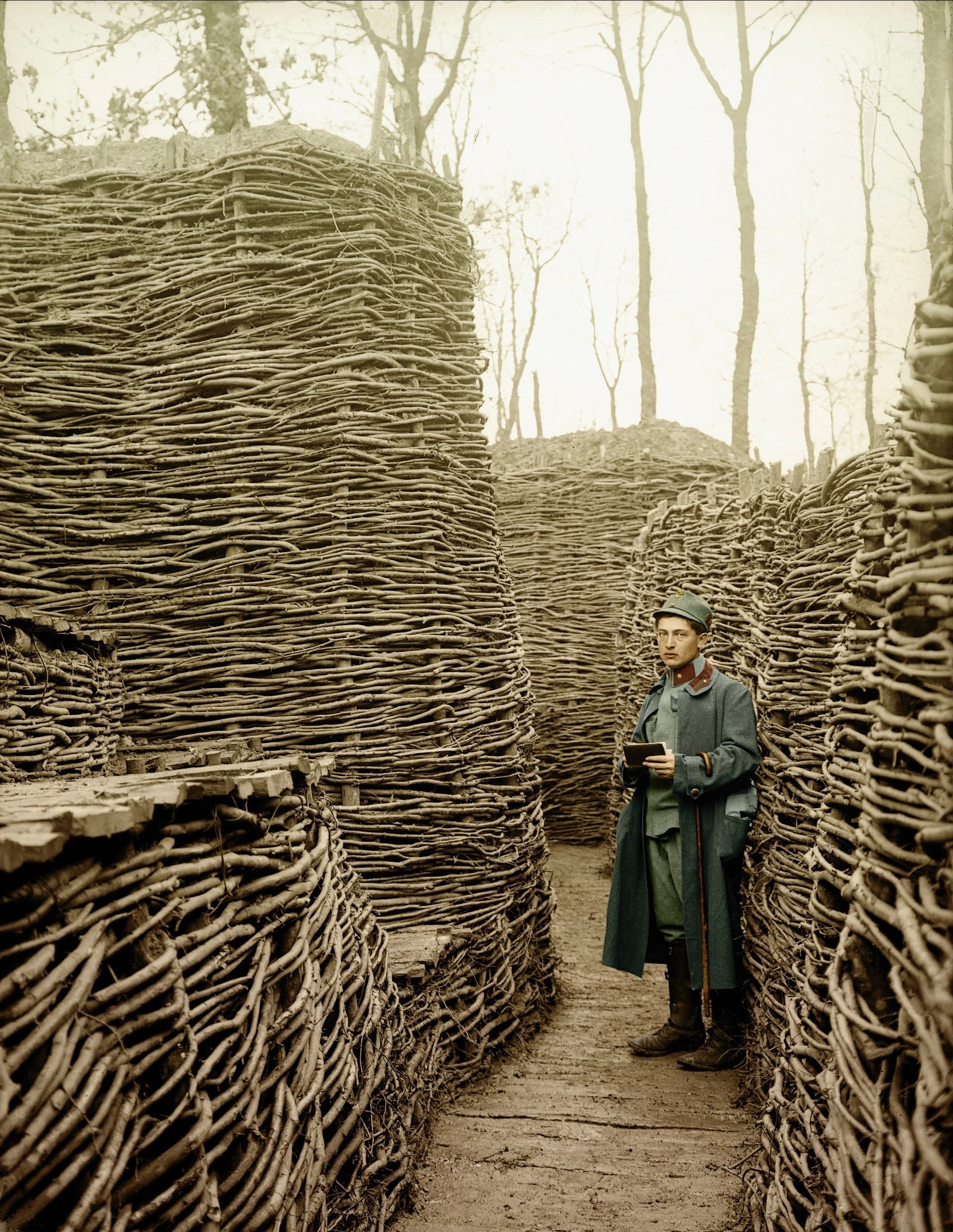 Austrian soldier in a trench on the eastern front, which has been secured with fascines (rough bundle of brushwood), Russia. Photo Hans Hildebrand, 1915. Collection Galerie Bilderwelt / The Bridgeman Art Library 