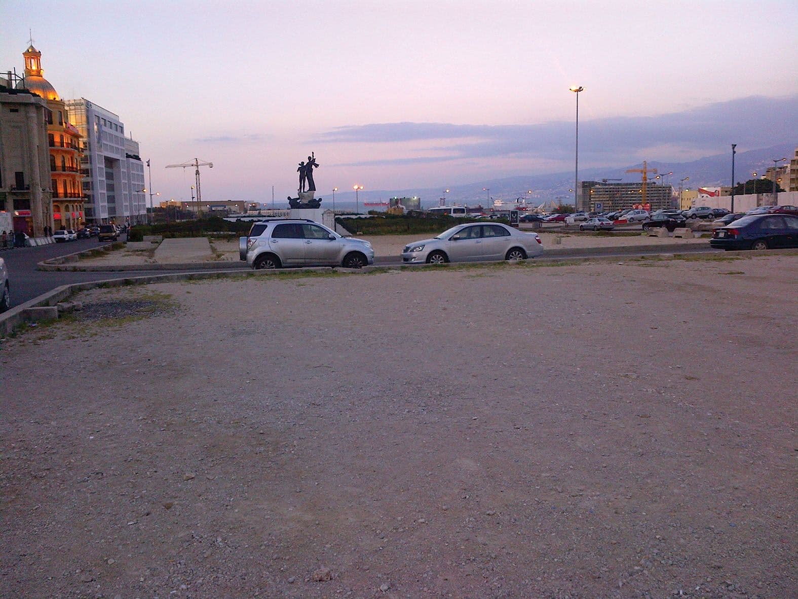 Cars on a waste land. Photo from the book Architecture After War.