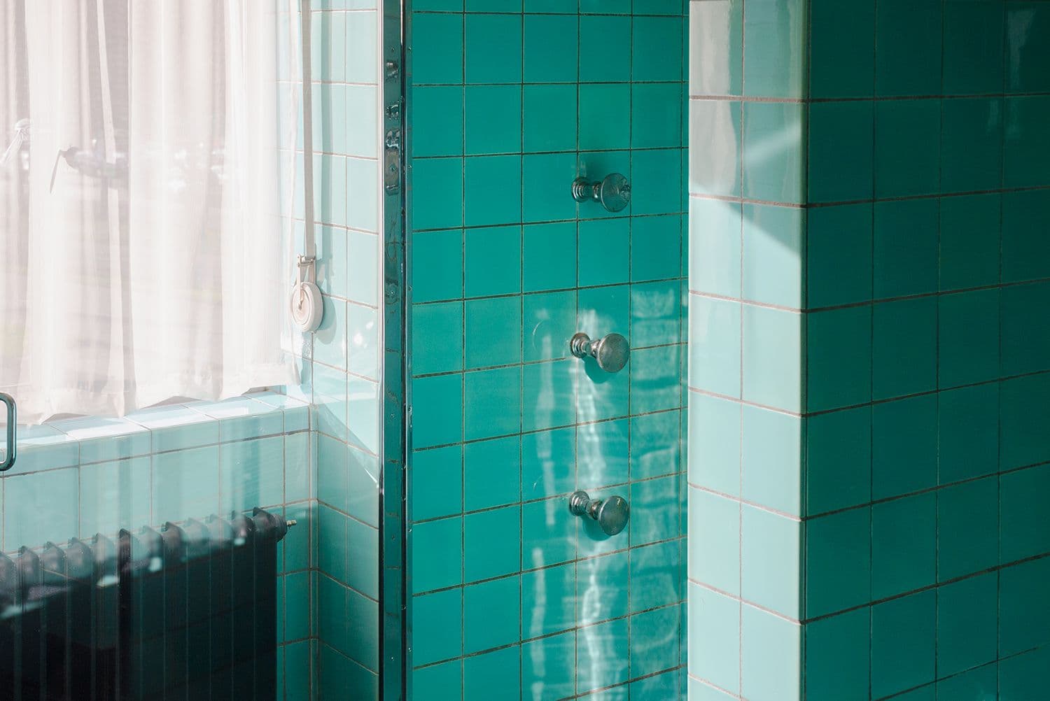 Shower heads in the bathroom. Photo Petra van der Ree 