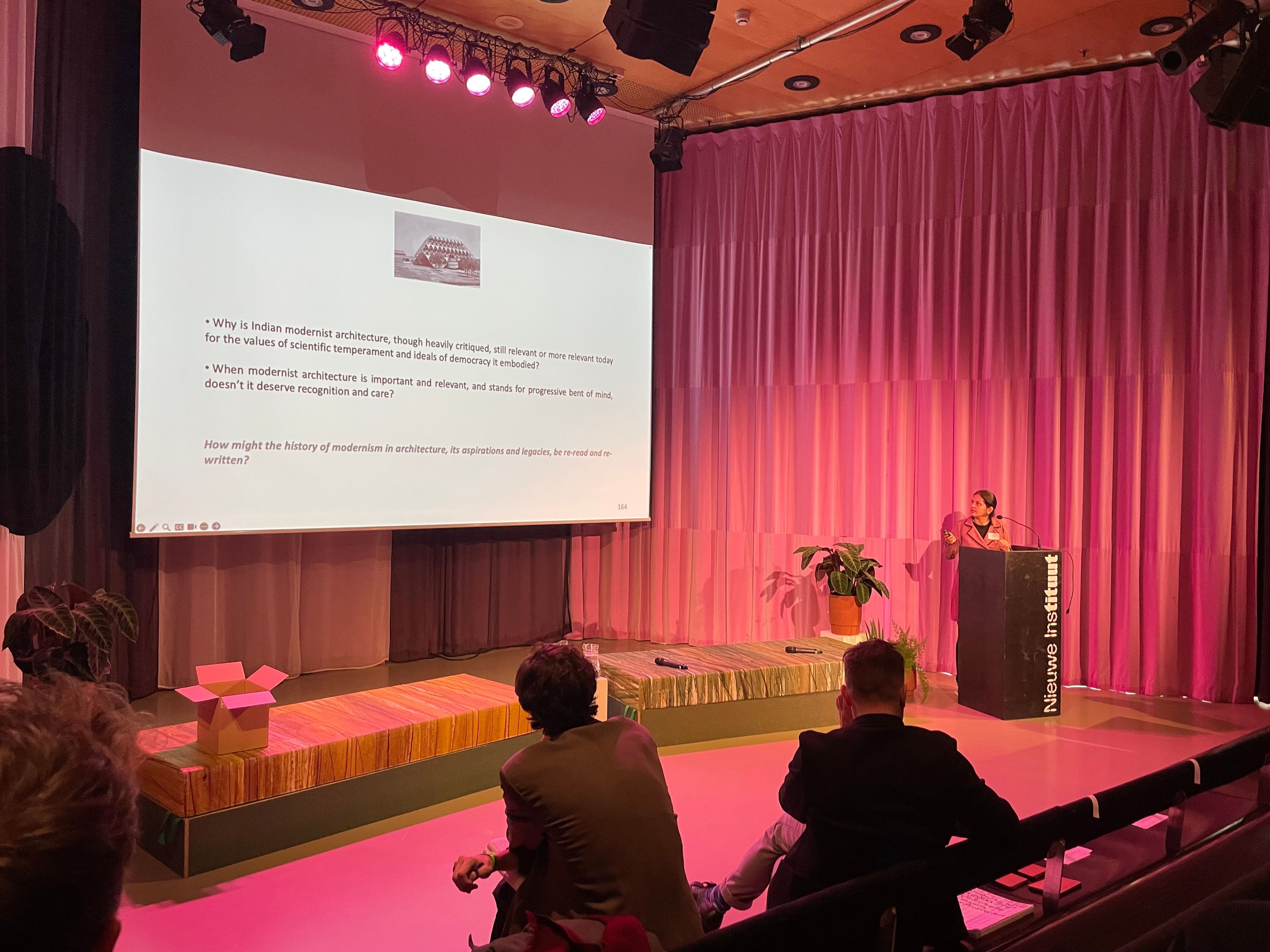 Shruti Hussain presenting in the auditorium of the Nieuwe Instituut