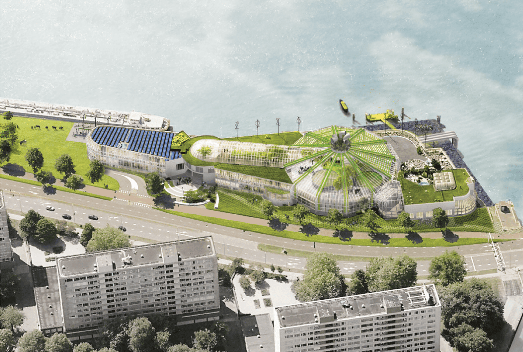 Aerial photo of building on a coastline, with unconventional building shapes and grass, trees and plants.
