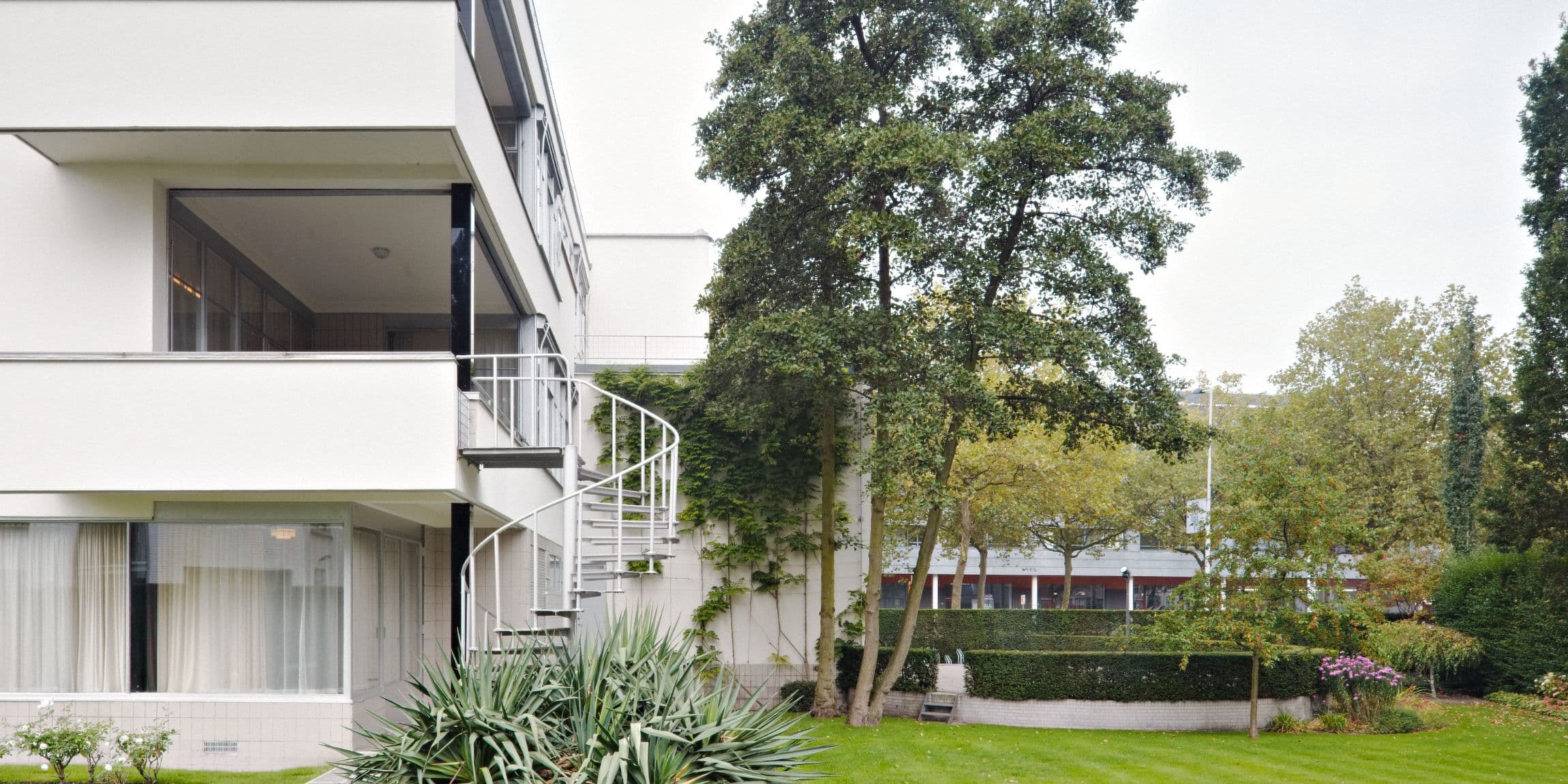 The garden of the white villa Sonneveld House.