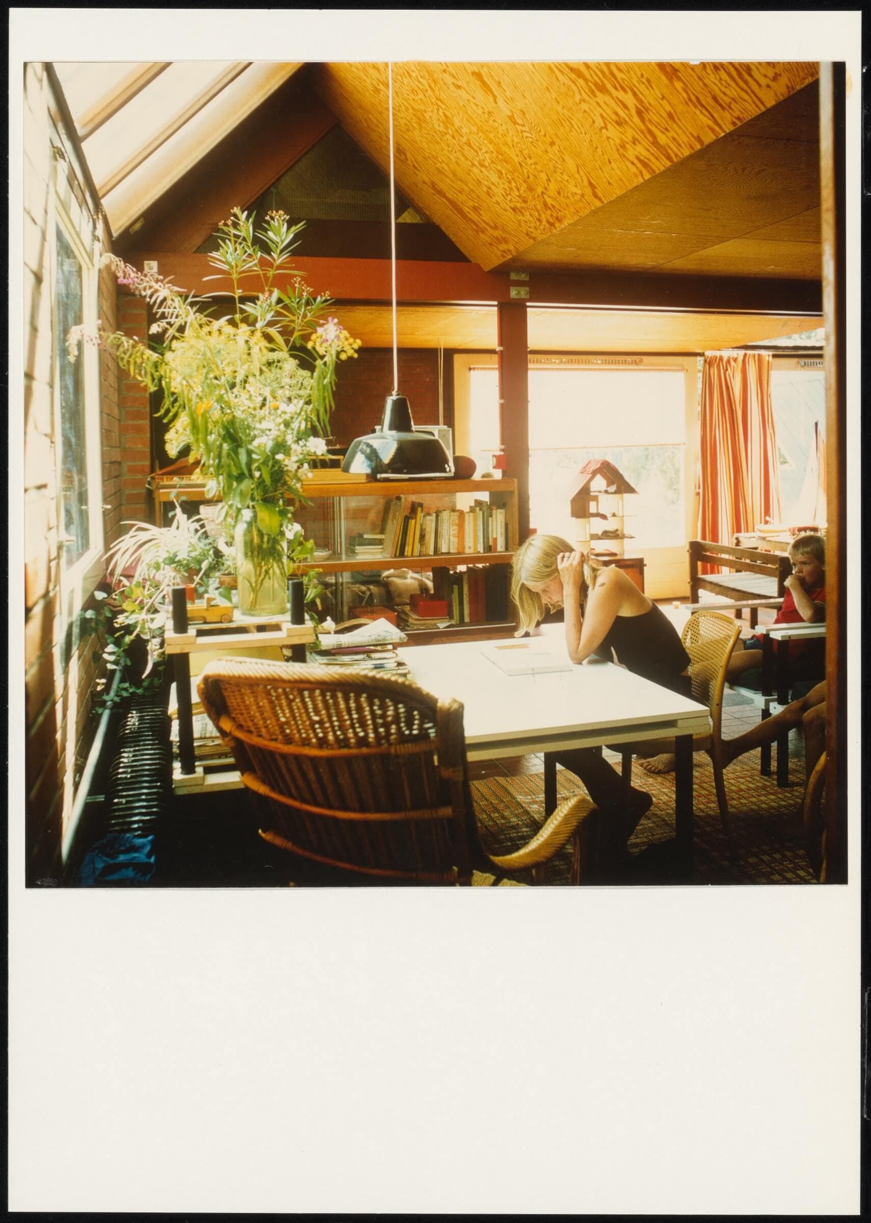 Is this a photo of a house, or a photo of a child reading? A person who seems unaware of the photographer is unusual in photos of interiors. In architectural photos, people often look self-conscious, but not in this case. E. Jelles. The Sc…  