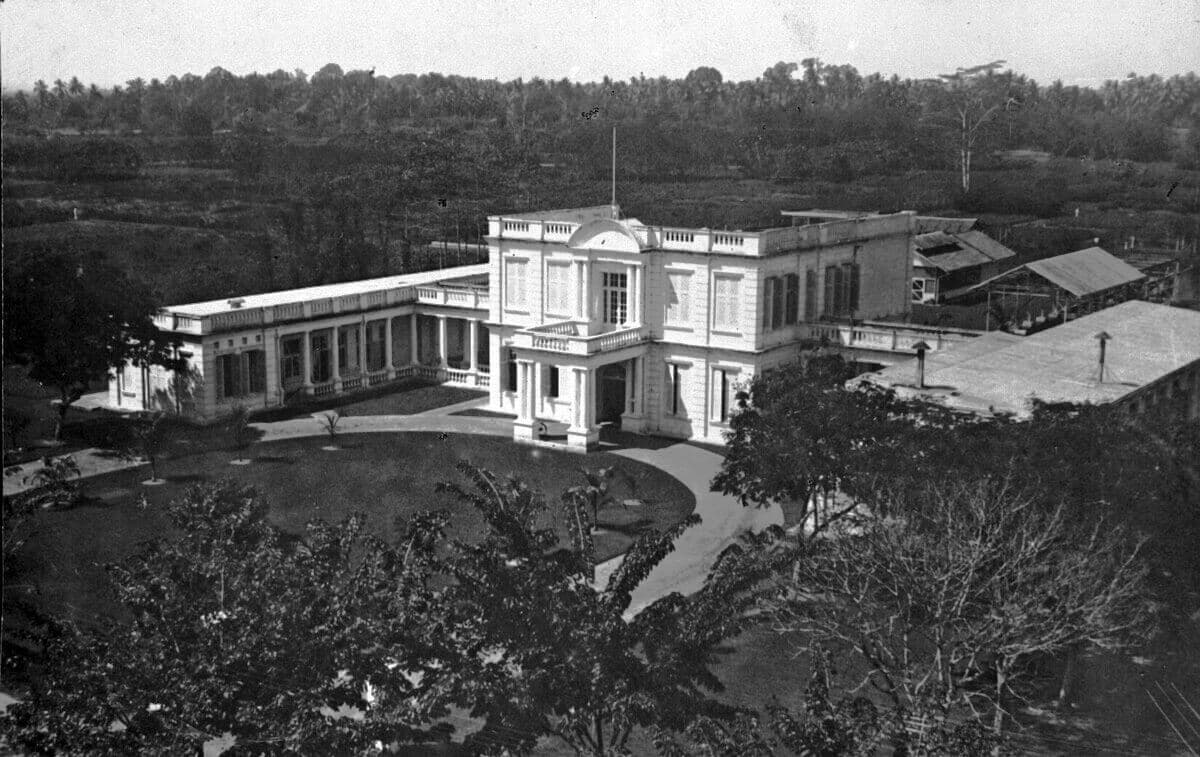 A botanical station in Deli, East Sumatra. This research complex housed laboratories in its Neoclassical structure, while testing field behind the building allowed agronomists to experiment with various physical and chemical plant treatmen… 