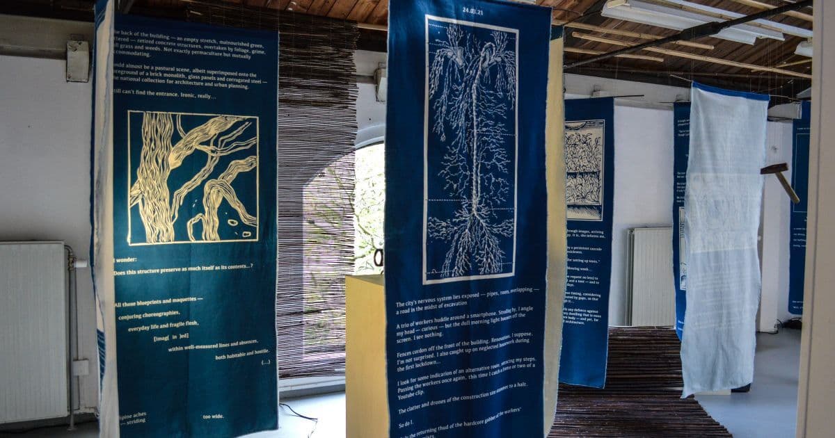 Turquoise and Blue banners by Hannah Dawn Henderson, showing the human nervous system accompanied by prose. Photos courtesy of the artist.