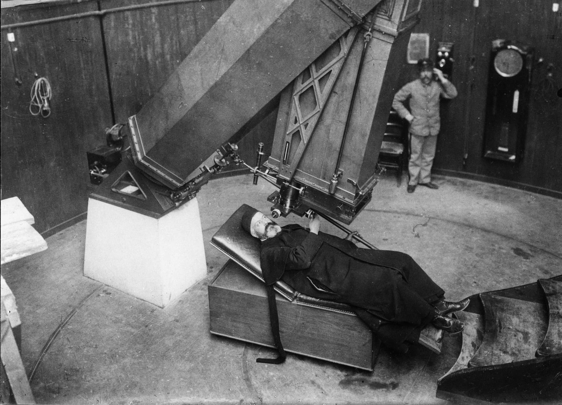 Friar looking through a telescope, Historical photo of Vatican Observatory. Collection Specola Vaticana 