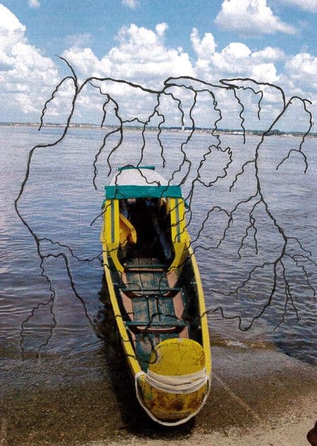 Hand-drawn map of the rivers of Suriname overlaid on a photograph of a korjaal docked on the bank of the River Marowijne (which forms the border between Suriname and French Guiana). Sean Leonard, 2020.