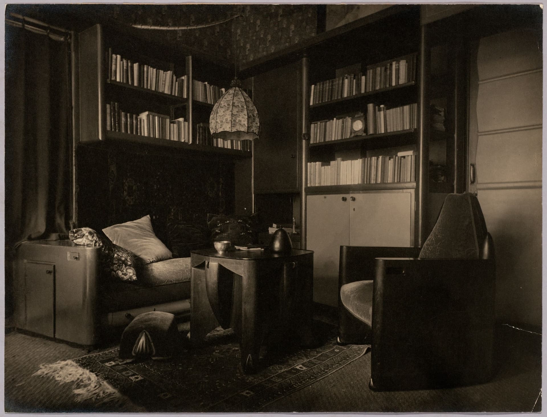 The essence of cosiness and comfort – just look at the polished wood on those rounded corners! The velvet cushions, the plush carpets and curtains! Does daylight ever get in here? It's a bit suffocating, perhaps, but so well designed it ha… 