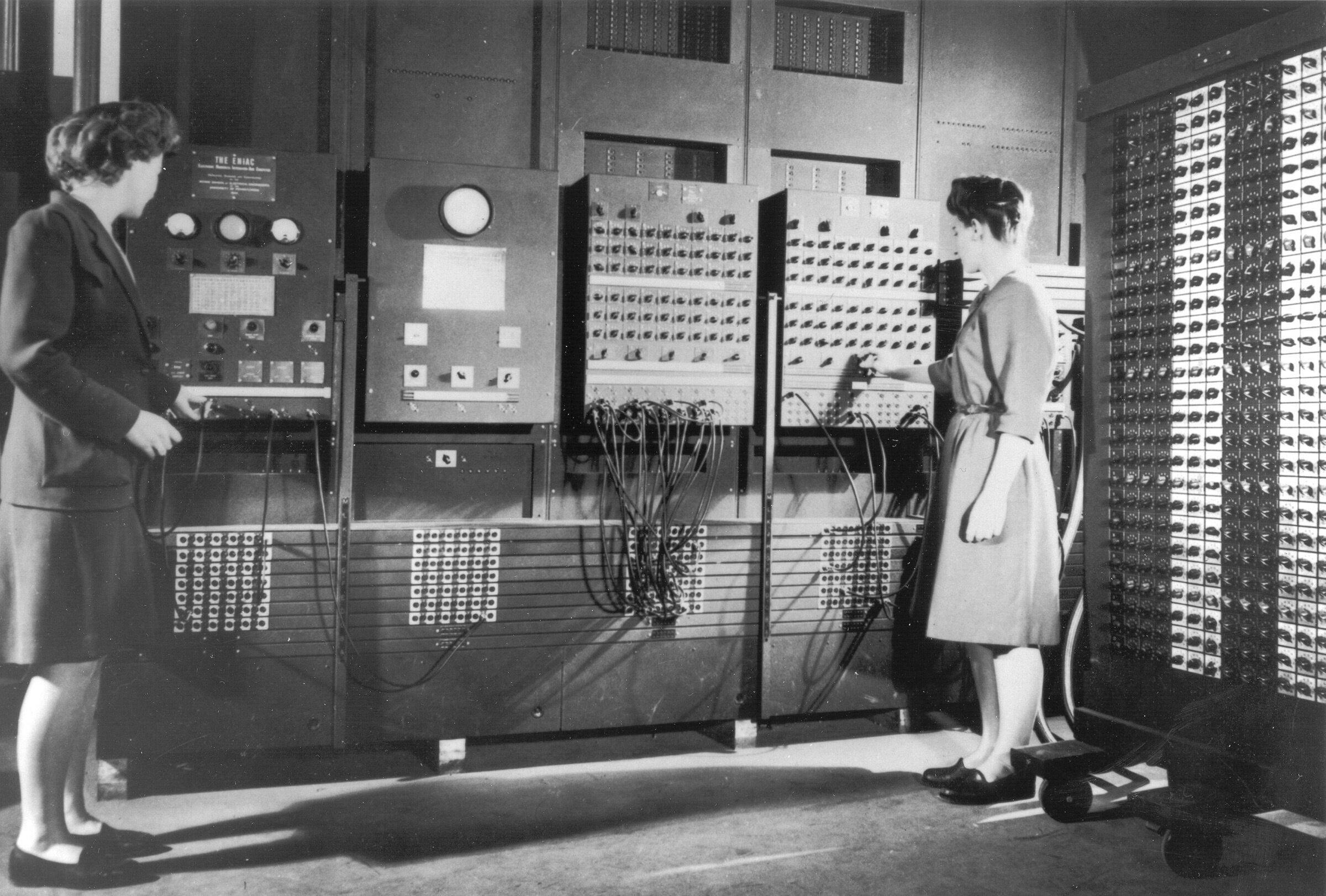 Betty Jennings (Mrs. Bartik) and Frances Bilas (Mrs. Spence) operating the ENIAC’s main control panel while the machine was still located at the Moore School. Source: ARL Technical Library/Historic Computer Images/Public Domain