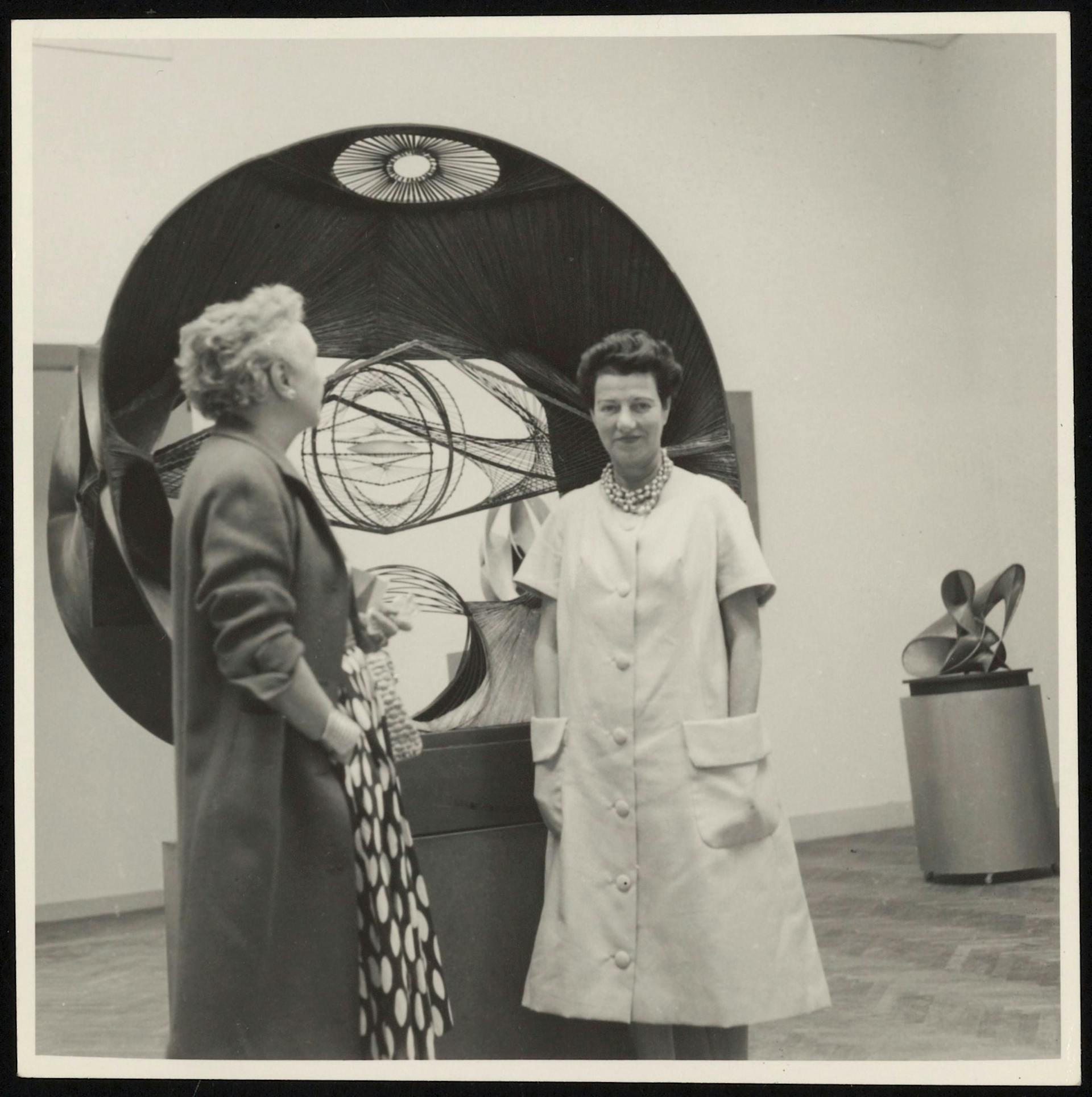 Nelly van Doesburg and Peggy Guggenheim in an exhibition gallery during the Venice Biennale. Collection RKD. Archive Theo and Nelly van Doesburg. 